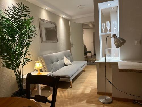 a living room with a couch and a table at Romantic Space in Nussbaumen
