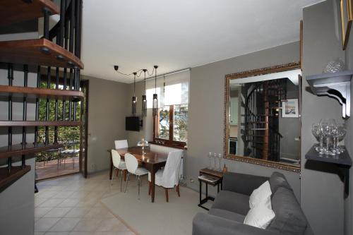 a living room with a couch and a table at wonderful lake front appartment near Bellagio in Limonta