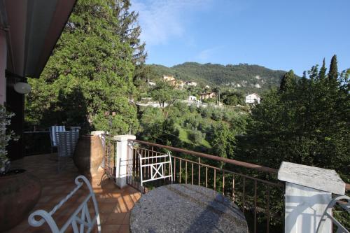 a balcony with a view of a mountain at wonderful lake front appartment near Bellagio in Limonta