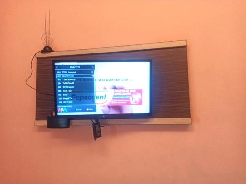 Телевизор и/или развлекательный центр в City Inn Antang