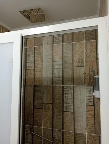 a sliding glass door with old books on it at Hostal 1009 Valdivia in Valdivia