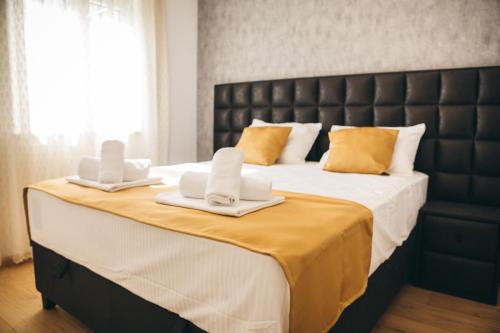 מיטה או מיטות בחדר ב-Family apartment Mirjam