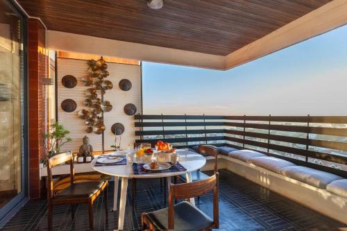 a room with a table and chairs and a couch at Atlantic Views Luxury Retreat in Estoril