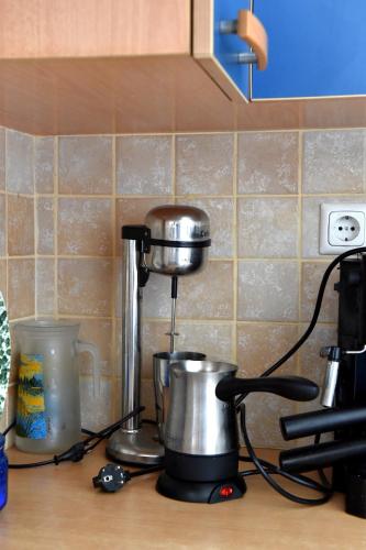 a kitchen counter with a coffee maker on a stove at Villa Elpida in Kanali