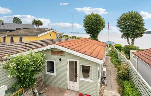 an overhead view of a green house with an orange roof at Lovely Home In Hejls With Wifi in Hejls