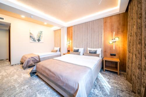 Postel nebo postele na pokoji v ubytování Hotel RK