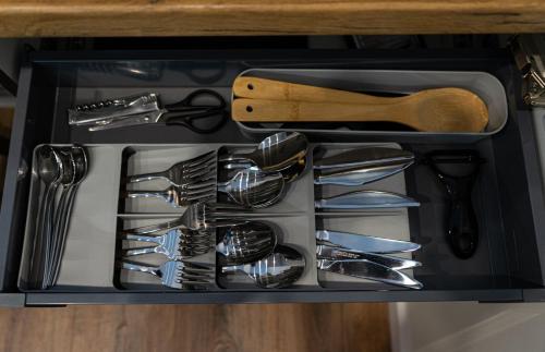 a drawer full of utensils in a kitchen at FLATMORE Apartament Akacjowa 17m1A in Zielona Góra
