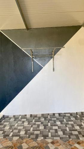 a metal ramp in a room with a checkered floor at Welcome to Big BL's house, Close to Tanger Med in Ksar es Sghir