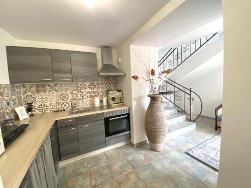 a kitchen with a vase in the middle of a room at Villa Lillybeth - Lake Balaton in Keszthely