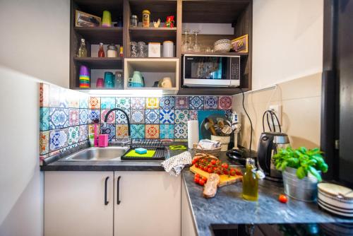 a small kitchen with a sink and a counter top at Boho House 2 in camp Terme Catez in Čatež ob Savi