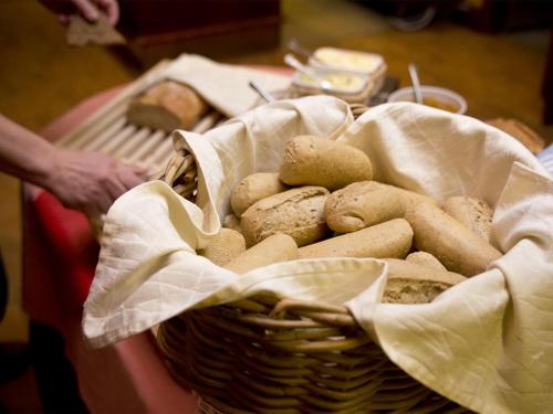 a basket of mushrooms sitting on top of a table at Kauppahotelli in Lahti