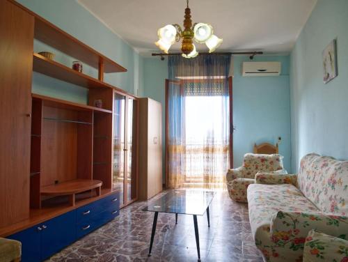 a living room with a couch and a coffee table at Casa vacanze BellaVista in Iglesias