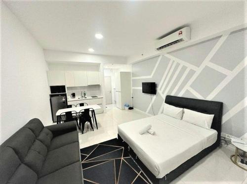 a living room with a couch and a table at Chambers Suites KL - by Staycation Homes in Kuala Lumpur