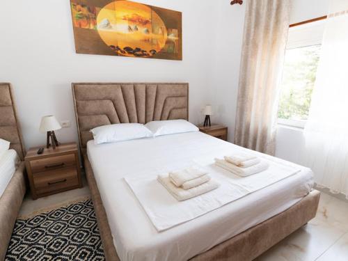 Postel nebo postele na pokoji v ubytování Roel Apartments