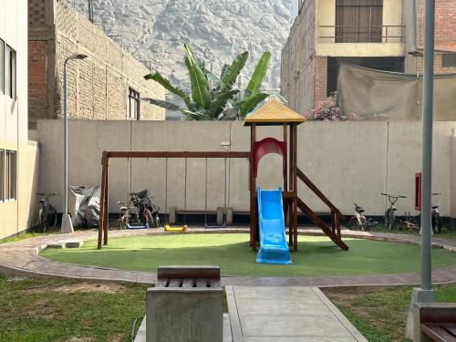 a playground in a building with a slide at Departamento en Ñaña, Chaclacayo, Lurigancho - Chosica in Alto Peru