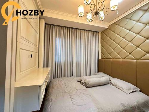 Ein Bett oder Betten in einem Zimmer der Unterkunft Signature Park Grande Serviced Condominium LRT Jakarta 2BR