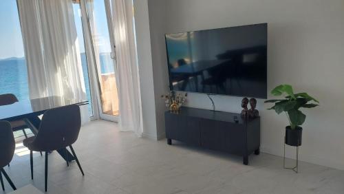 a living room with a large flat screen tv at Apartment Nino in Zadar