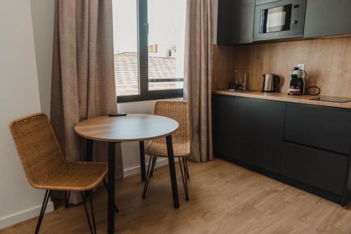 Kuchyň nebo kuchyňský kout v ubytování esZentrico Suites Jerez