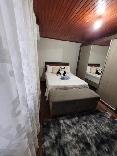 Postel nebo postele na pokoji v ubytování Casa Justi Oliveira