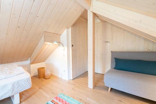 Cama ou camas em um quarto em Iris Strandhus
