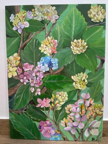 a painting of flowers on a table at Apartamentos 4 estações in Faja Grande