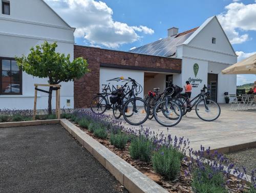 a group of bikes parked in front of a building at ZánKapu Szálláshely in Zánka