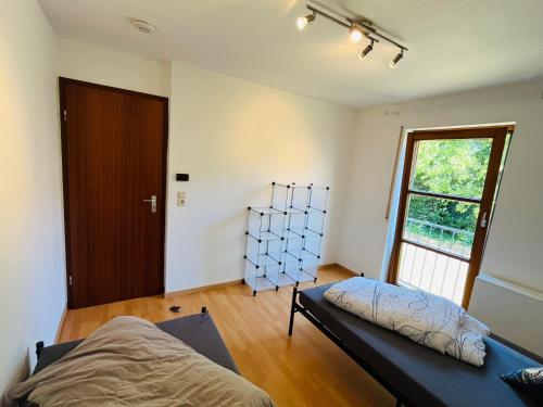 a bedroom with a bed and a window at City Appartement Kirchheim in Kirchheim unter Teck