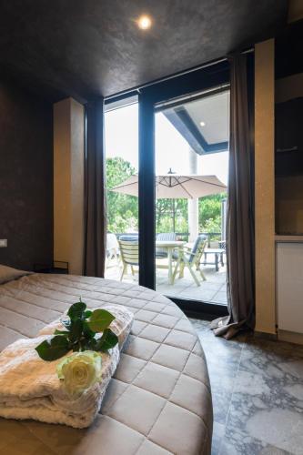 a bedroom with a bed with a flower on it at garda fantasy paradise silver o gold in Desenzano del Garda
