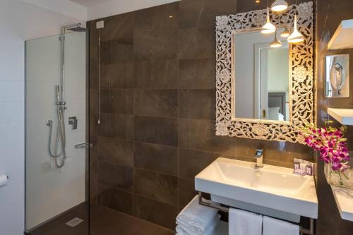a bathroom with a sink and a shower at Hotel Maestrale in Riccione