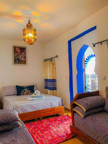 Postel nebo postele na pokoji v ubytování Riad Said Chaouen