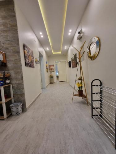 a long hallway with a mirror on the wall at ملحق فخم جداً متكامل بسطح مستقل ومدخل مستقل in Abha