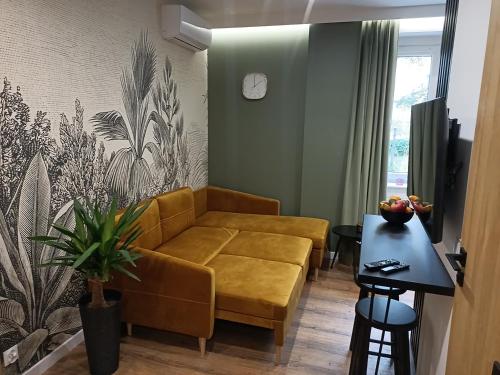 a living room with a couch and a table at FREEDOM APART Akacjowa 17m1B in Zielona Góra