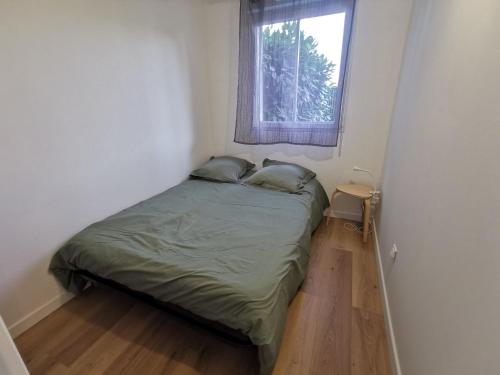 Posteľ alebo postele v izbe v ubytovaní Appartement proche plages