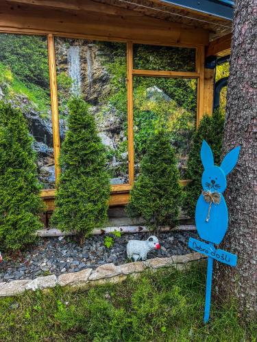 a sign with a bunny on it in front of a house at Vila Bašić Vlašić Apartman MEDO in Vlasic