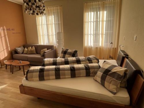 a living room with two couches and a couch at Hotel Krone Sihlbrugg in Sihlbrugg Dorf