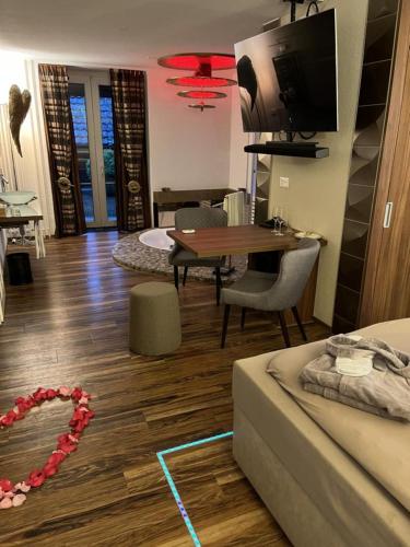 a living room with a couch and a table at Hotel Krone Sihlbrugg in Sihlbrugg Dorf