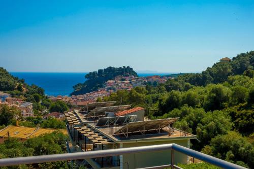 a building with a view of a city at Natura Luxury Suites Parga in Parga