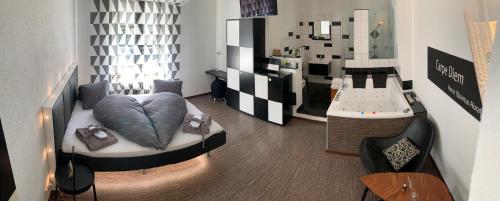 a living room with a bed and a mirror at Hotel Krone Sihlbrugg in Sihlbrugg Dorf