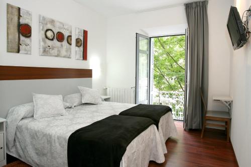 Posteľ alebo postele v izbe v ubytovaní Hostal San Ignacio Centro