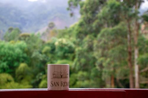 a coffee cup sitting on top of a table at Hotel Rural SAN REMO in Santa Rosa de Cabal