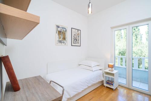 Postel nebo postele na pokoji v ubytování Penthouse Vis à Vis