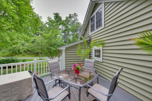 a patio with a table and chairs and a house at Charming Manheim Cottage with On-Site Animal Viewing in Manheim