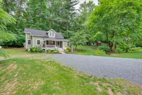 a house with a driveway in front of a yard at Charming Manheim Cottage with On-Site Animal Viewing in Manheim