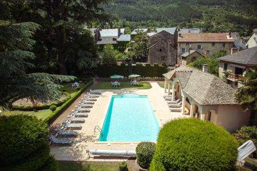 an aerial view of a swimming pool in a yard at Grand Hôtel du Parc in Florac