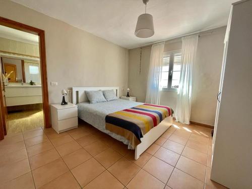 En eller flere senge i et værelse på Casa VEROLES