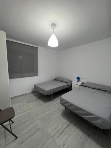 Postel nebo postele na pokoji v ubytování Vacaciones en la playa