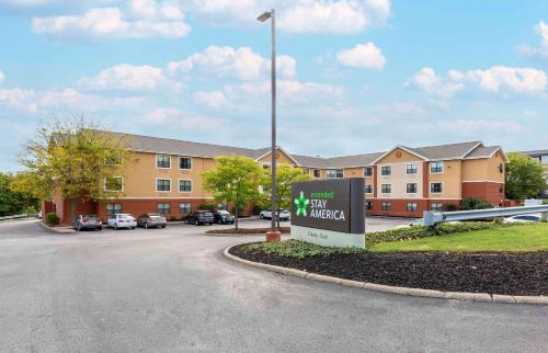 a sign in front of a building with a parking lot at Extended Stay America Suites - Akron - Copley - East in Copley