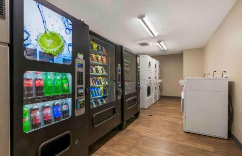 a vending machine with soda and drinks in a store at Extended Stay America Suites - Kansas City - Overland Park - Quivira Rd in Lenexa