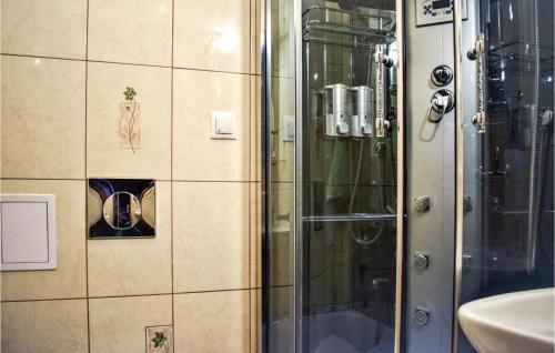 a shower with a glass door in a bathroom at Lovely Home In Rowy With Wifi in Rowy