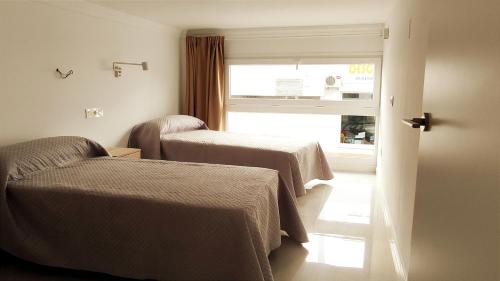 Posteľ alebo postele v izbe v ubytovaní El Rincón de Madera - Apartamento céntrico en Conil